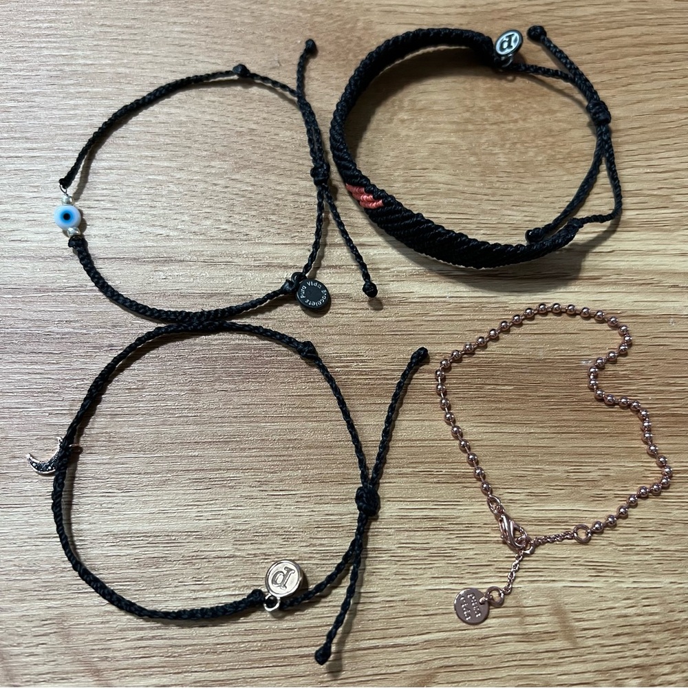 Pura Vida bracelet lot of 4. Adjustable. Black. Varied styles.